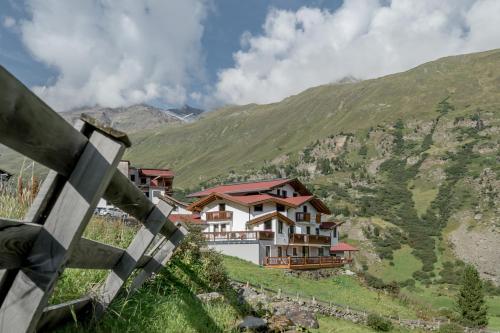 a house on the side of a mountain at Das Hochegg - Apartments in Obergurgl