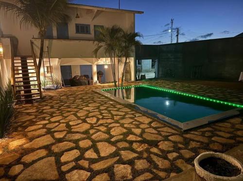 a swimming pool in the yard of a house at Pousada Caponga Praia Mar in Cascavel