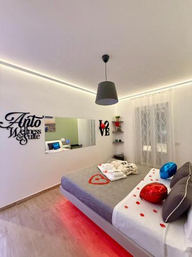 a bedroom with a large bed in a room at ANTO Wellness & Suite in Nova Siri Marina