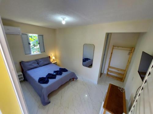 Giường trong phòng chung tại Suíte do Deca - 500M do Centro Histórico