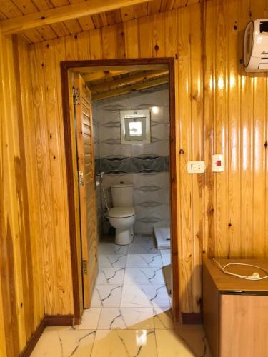 a bathroom with a toilet and a sink at White dune camp in Nuweiba‘ el Muzeinah