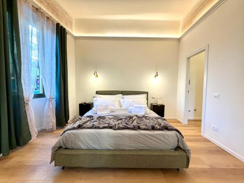 En eller flere senge i et værelse på Cortela Dimora Scaligera