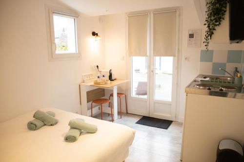 Ένα ή περισσότερα κρεβάτια σε δωμάτιο στο Résidence Zénith