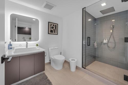 a bathroom with a toilet and a sink and a shower at Breathtaking studio in the Heart Miami in Miami