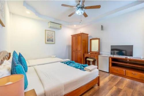 En eller flere senge i et værelse på NO 7 Garden Villa