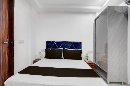 Ένα ή περισσότερα κρεβάτια σε δωμάτιο στο Hotel O RV Residency