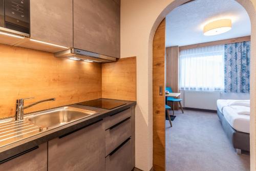 Ένα ή περισσότερα κρεβάτια σε δωμάτιο στο Hotel Garni Försterheim