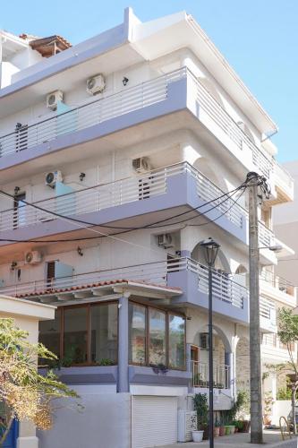 a building with balconies on the side of it at Posidonio Hotel in Chania