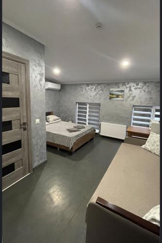 a large bedroom with two beds and a door at Family2 in Mukacheve