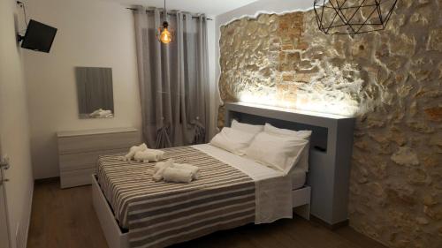 Ένα ή περισσότερα κρεβάτια σε δωμάτιο στο La Casa dei DOGI