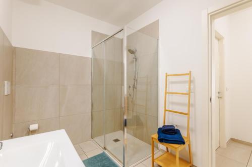 a bathroom with a shower with a glass door at FaCentro - Free WiFi & Air Conditioning in Faenza