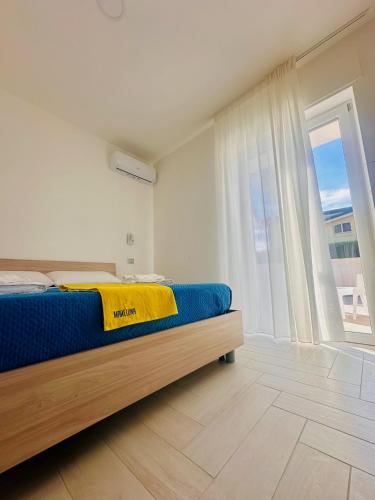 Ένα ή περισσότερα κρεβάτια σε δωμάτιο στο MareLuna - Your home by the sea