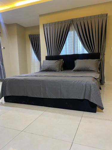 a bedroom with a large bed with a window at Noahjoelestate in Accra