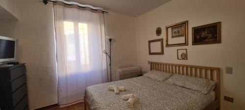 Giường trong phòng chung tại Il Micco House