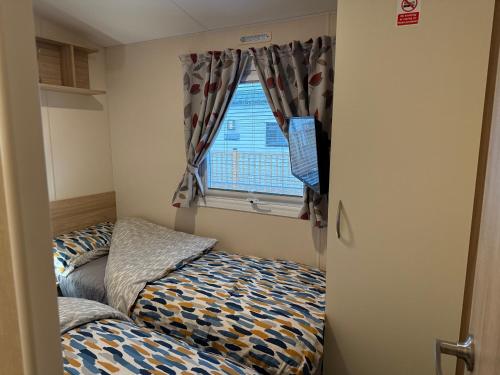 Postel nebo postele na pokoji v ubytování Riverside Haven