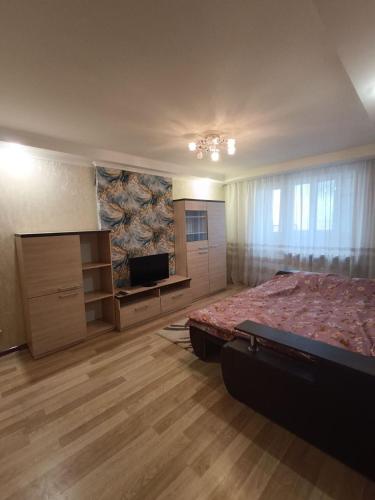 En eller flere senge i et værelse på Здам однокімнатну квартиру