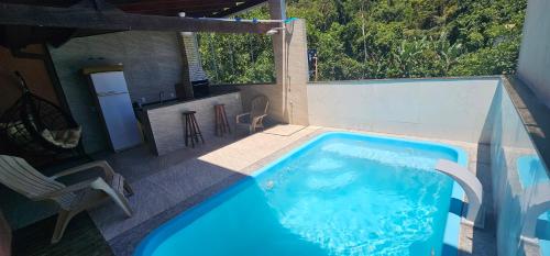 Bazén v ubytování Casa Premium Paraty com Piscina Aquecida e Passeio de Escuna de Cortesia incluso nebo v jeho okolí