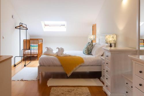 Ένα ή περισσότερα κρεβάτια σε δωμάτιο στο Fão Apart Vacation Apartments