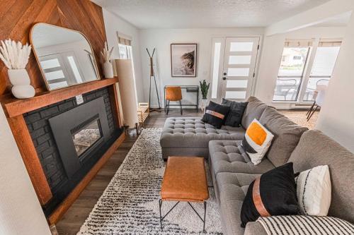 a living room with a couch and a fireplace at Cozy Cove Cottage in Seaside