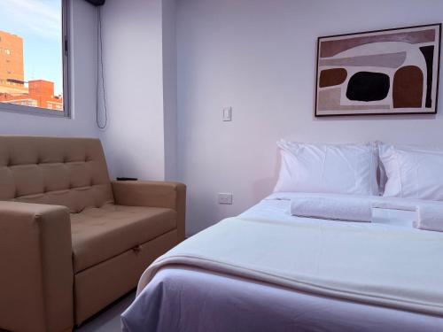 Giường trong phòng chung tại Duitama Loft