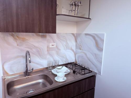 O bucătărie sau chicinetă la Duitama Loft