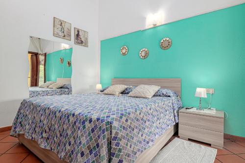 Ένα ή περισσότερα κρεβάτια σε δωμάτιο στο Villetta Via Tempio