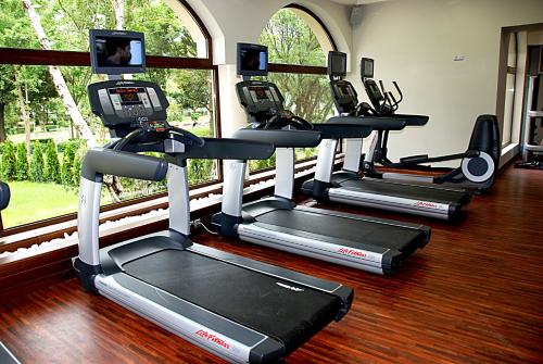 a row of treadmills in a fitness room at Primoretz Grand Hotel & Spa in Burgas City