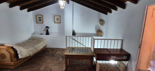 Giường trong phòng chung tại Cortijo Palomo