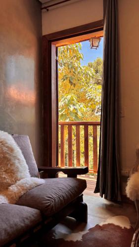 Кровать или кровати в номере Encanto das Araucárias II