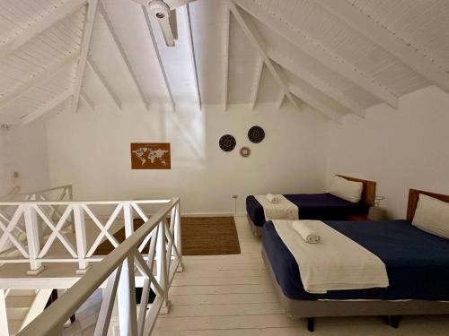 Ένα ή περισσότερα κρεβάτια σε δωμάτιο στο Casa Siete Las Terrenas