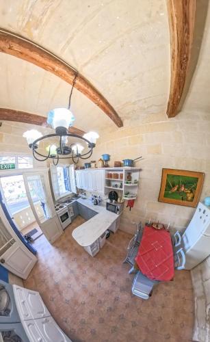 an overhead view of a living room with a chandelier at Blue Sunrise in Birżebbuġa
