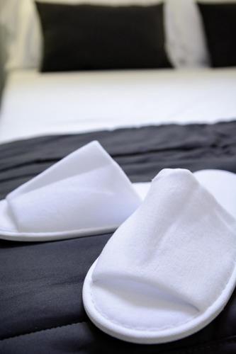two white napkins sitting on top of a table at B&B al Palazzo in Agropoli