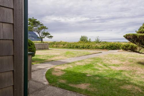 a view of a yard from a house at The Tides in Seaside