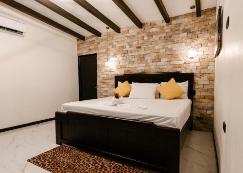 Ένα ή περισσότερα κρεβάτια σε δωμάτιο στο Aralias Villas