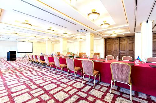 a conference room with a long table and chairs at Primoretz Grand Hotel & Spa in Burgas City