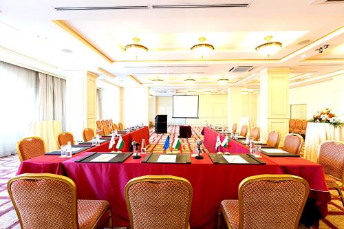 a large conference room with a table and chairs at Primoretz Grand Hotel & Spa in Burgas City
