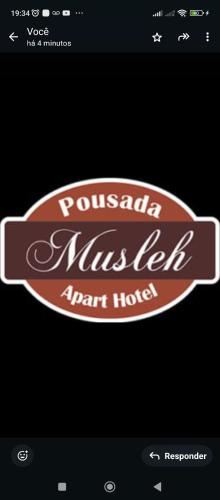 リオ・グランデにあるMusleh pousadaのポフタール・ムステル代理店の看板
