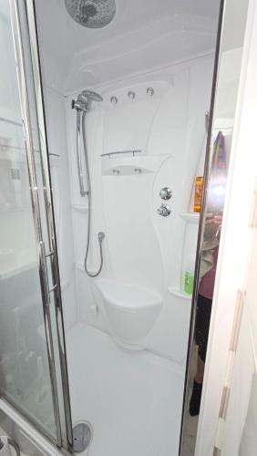 a bathroom with a shower and a toilet at Wembley Park prime location for Stadium events City break in London