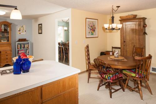 a kitchen with a table and a dining room at Family Tides in Seaside in Seaside