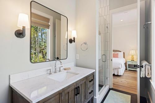 a bathroom with a sink and a mirror at BW3131: 3131 Baywood Drive in Seabrook Island