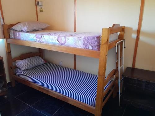 a couple of bunk beds in a room at Mateo y Stella 3 in Bialet Massé