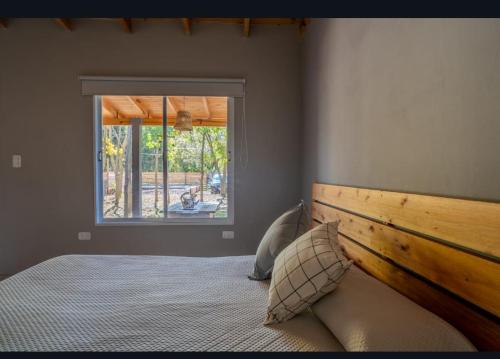 Ένα ή περισσότερα κρεβάτια σε δωμάτιο στο Tranqueras al norte