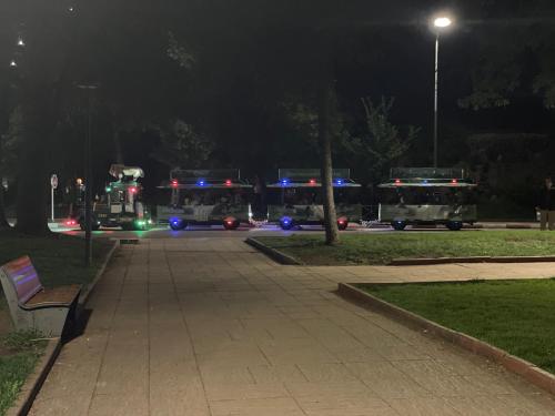 three fire trucks parked in a parking lot at night at Chalet villa QUE POUR LES FAMILLES in Imouzzer Kandar