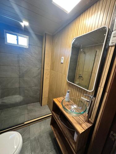 a bathroom with a sink and a shower at Serendipia in Maldonado