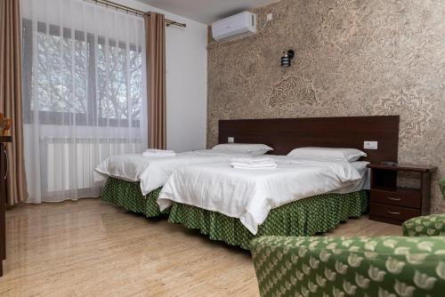 Postel nebo postele na pokoji v ubytování Pensiunea VIS