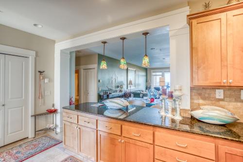 a kitchen with a sink and a large mirror at Sunsets at the Shoreline in Newport