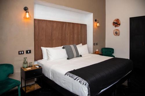 Ένα ή περισσότερα κρεβάτια σε δωμάτιο στο Hotel MariaBonita San Miguel de Allende