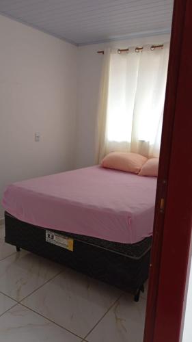 Ένα ή περισσότερα κρεβάτια σε δωμάτιο στο Recanto Santa Lídia