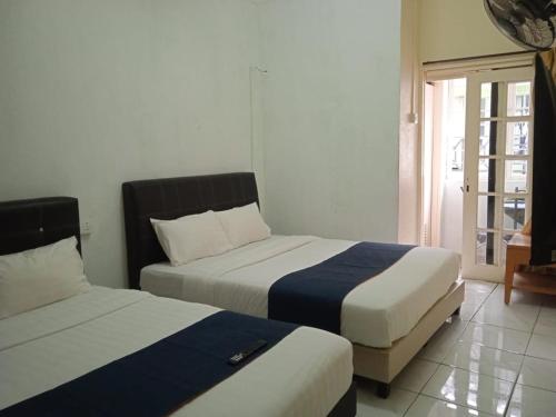 Ένα ή περισσότερα κρεβάτια σε δωμάτιο στο Rest N Go CH