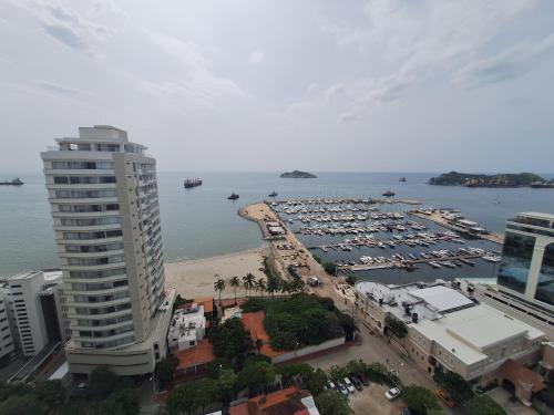 an aerial view of a marina with a large building at Nuevo Apartaestudio en frente de la marina in Santa Marta